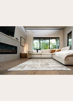 Modern living room with a sectional sofa, rug, and large windows.