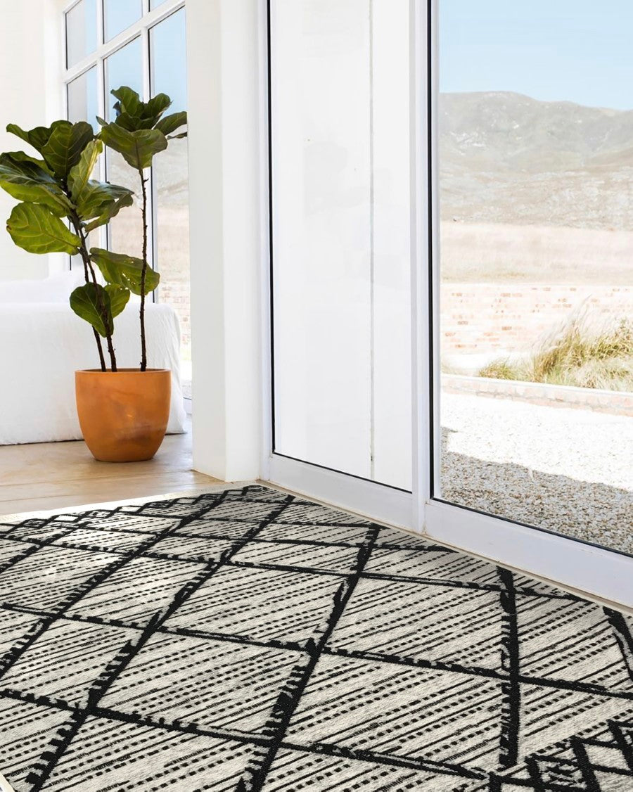 Washable Area rug | Simon & Yildirim Reversible Simple | Black & White by door view | 9x11 | By MotherRuggers.com | Machine Washable | Jacquard Woven | Uniquely Reversible | Pet Friendly | Kid Friendly | Machine Wash | Line Dry | Living Room | Covered Patio | Entry Way | Bedroom | High-Traffic | Three-year warranty with proper care | Shake or light Vacuum | Machine Wash as needed | Dry Flat or Line Dry | Dries fast