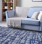 Washable Area rug | Simon & Yildirim Reversible Trade | Navy & Beige Lifestyle View with couch | 5x8 | By MotherRuggers.com | Machine Washable | Jacquard Woven | Uniquely Reversible | Pet Friendly | Kid Friendly | Machine Wash | Line Dry | Living Room | Covered Patio | Entry Way | Bedroom | High-Traffic | Three-year warranty with proper care | Shake or light Vacuum | Machine Wash as needed | Dry Flat or Line Dry | Dries fast