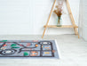 Rugaroos Town Square Kid's Machine Washable Play Rug | Colorful Cars following multiple roads through Town| Lifestyle View | 4x6 | Mother Ruggers | Washable Rugs | Kid's Rugs | Eco Friendly Rug| Pet Friendly | Kid Friendly | Machine Wash | Line Dry | Bedroom | High-Traffic | Two-year warranty with proper care | Shake or light Vacuum | Machine Wash as needed | Dry Flat or Line Dry | Dries fast | Hand Drawn - Digitally Printed | Velvet | Easy- Clean